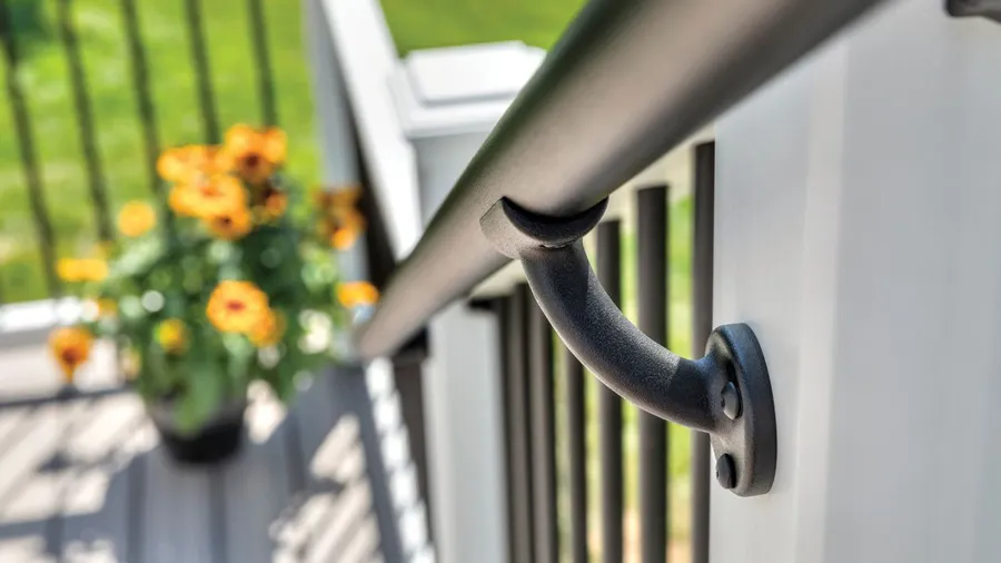 A Trex ADA handrail attached to a gorgeous composite deck railing
