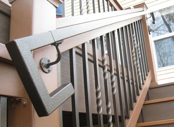 A square steel handrail on a set of deck stairs