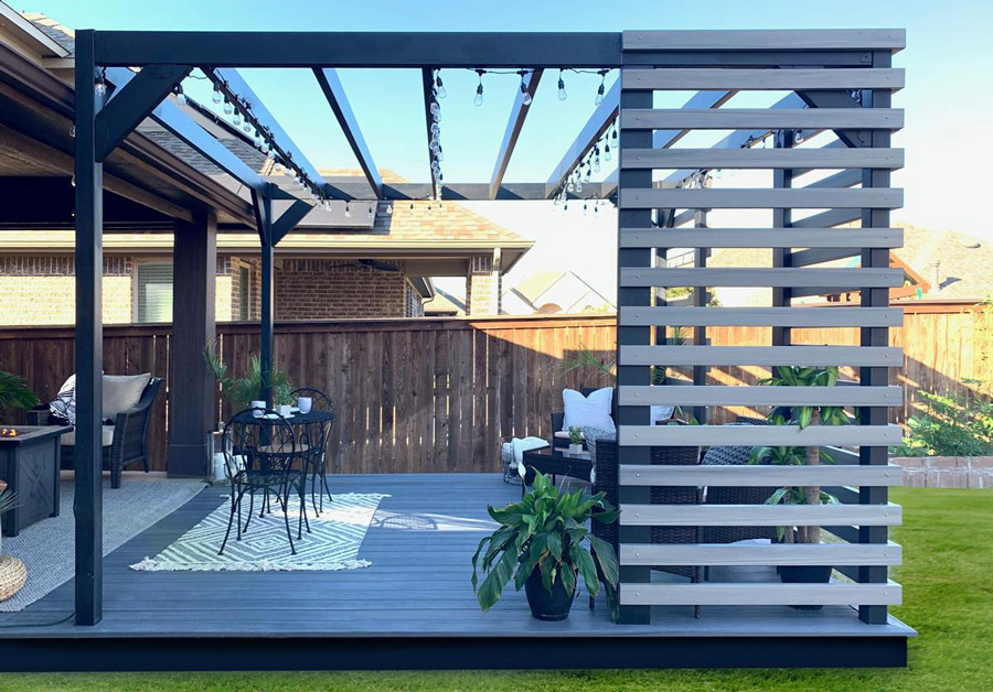 A modern Fortress Steel Pergola with wood slats attached