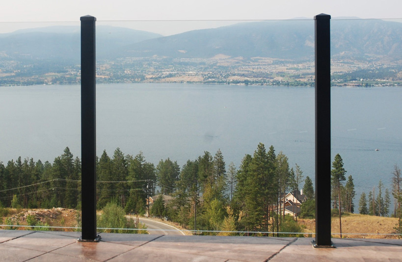 The wide-open view of a deck with a Century Scenic glass railing featuring no top rail