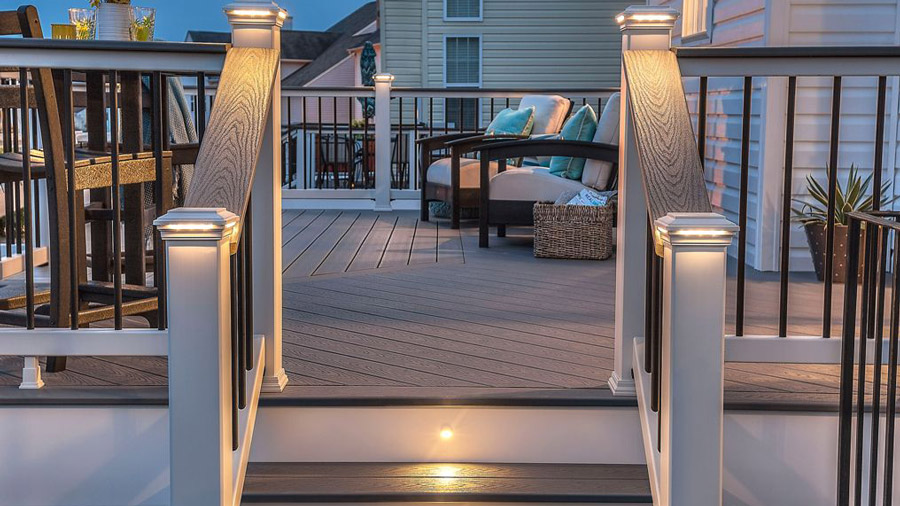 A lighted set of deck stairs at night