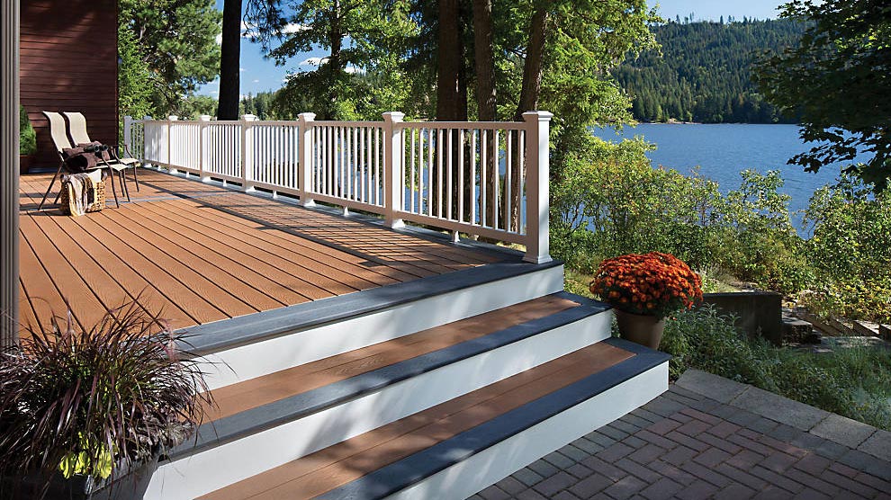 A deck using complementary colors to pair blue-gray boards with brown-orange boards for a striking contrast