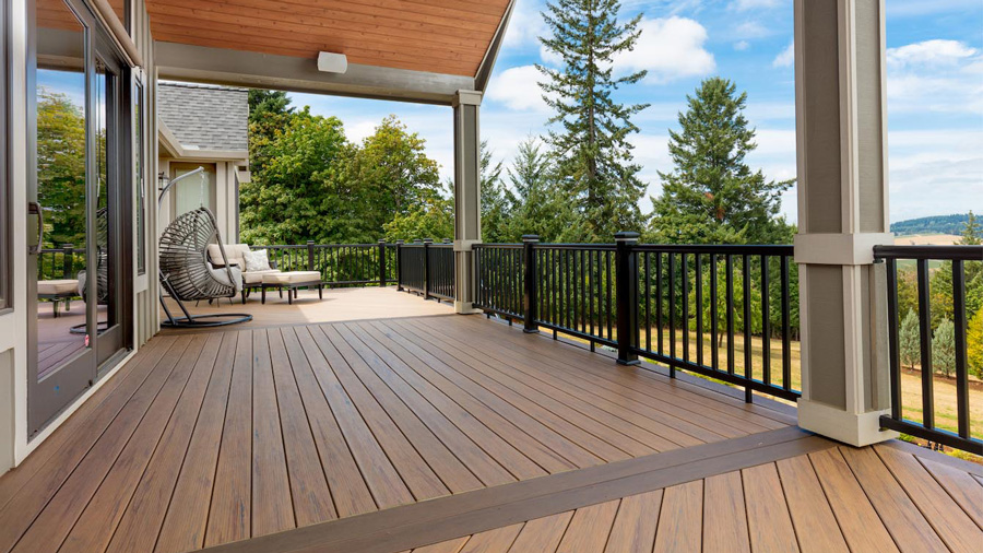 A deck made from TimberTech Tigerwood decking with a darker brown breaker board in the Mocha color