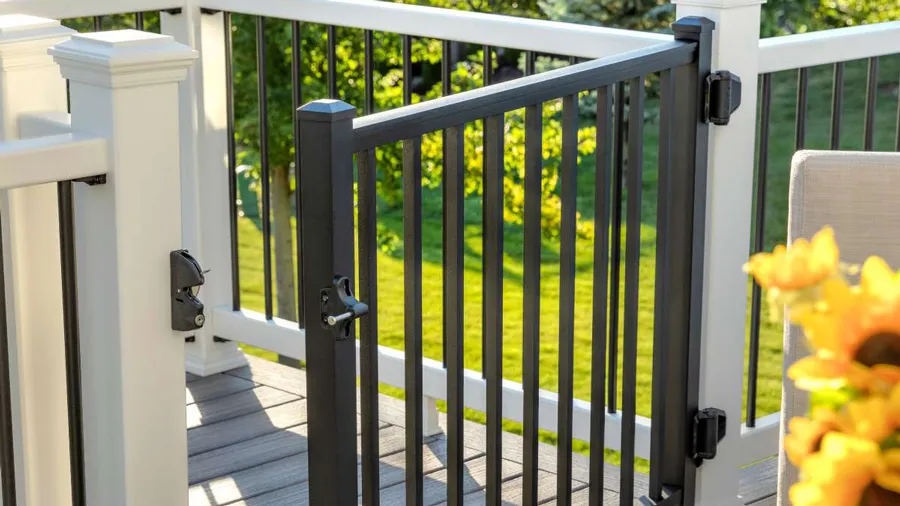 A Trex composite deck railing with a gorgeous metal gate attached