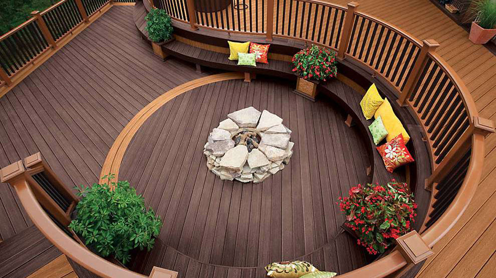 A two-level Trex deck pairing dark brown with bright orange-tan boards for a brilliant contrast