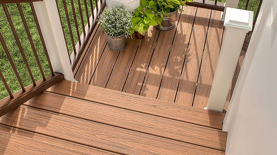 A set of deck stairs using Trex composite decking (Tiki Torch color) as stair treads