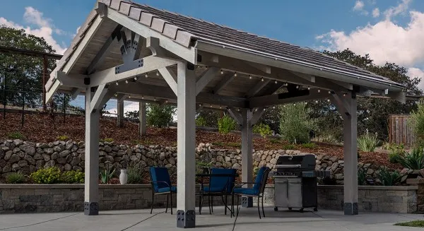 A gorgeous outdoor pergola structure using several different types of hardware brackets to attach wood connections