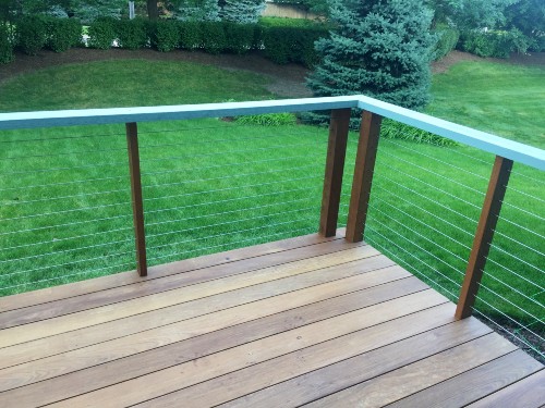 Mounting two deck posts in the corner of your deck railing allows the cable to turn at a slighter angle
