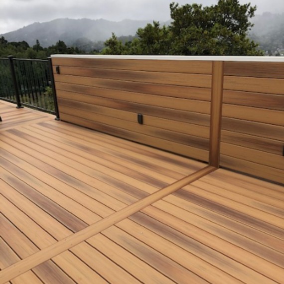 DuraLife composite deck boards in warm Golden Teak creates a stunning vision for our winner's uppper-level DIY deck build