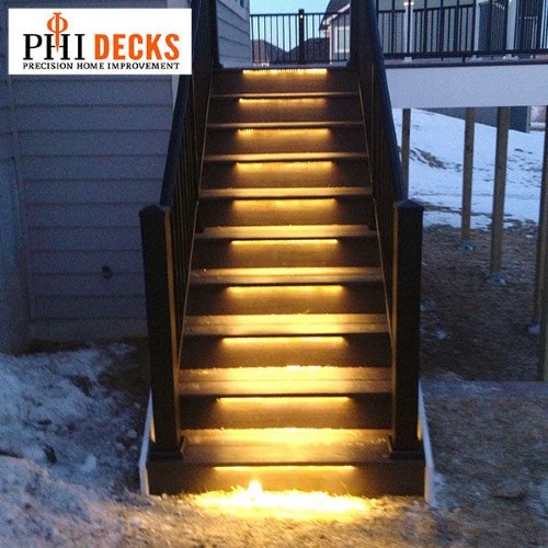 Installing deck lights under stair treads can increase the style and safety of your outdoor living space
