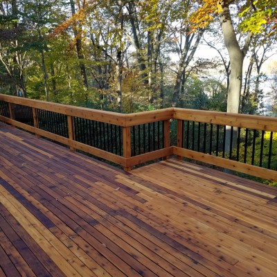 Get the best of both deck railing worlds by building a wood and metal deck railing design to showcase your home's outdoor space