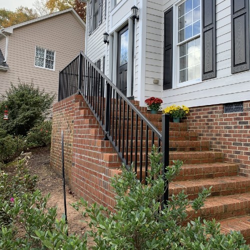 Brian installed rich, black powder-coated Westbury Tuscany metal railing along his stairs
