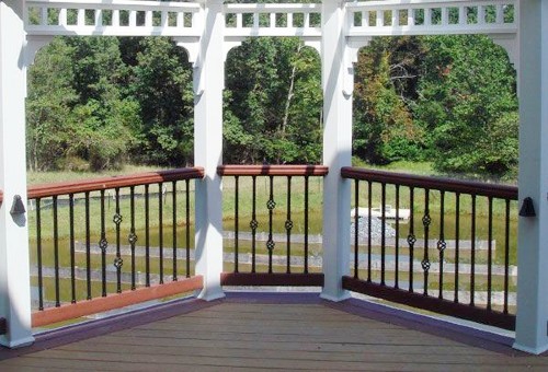 Beautiful powder-coated aluminum Dekor balusters liven up your wood deck railing and outdoor space