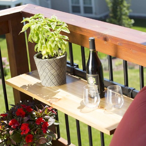 Make an outdoor deck railing table out of whichever wood, glass, or stone material you like with DIY deck rail tables