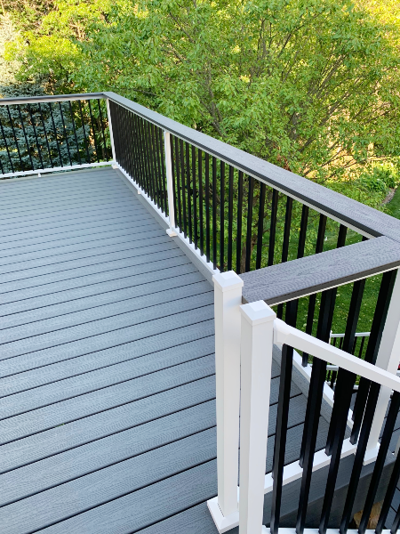 Does your outdoor space need a railing system installed like this beautiful metal railing line on a second story deck