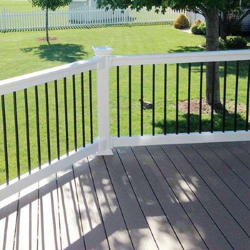 The popular Kirklees style of Durables Vinyl Railing completes its design with round black aluminum balusters