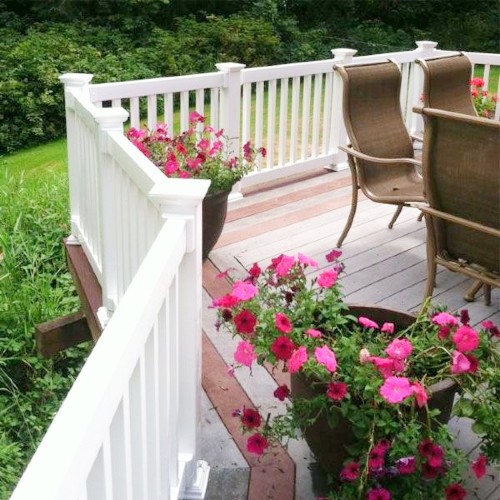 The Manchester style of Durables Vinyl Railing features square vinyl balusters and rectangular top and bottom rails