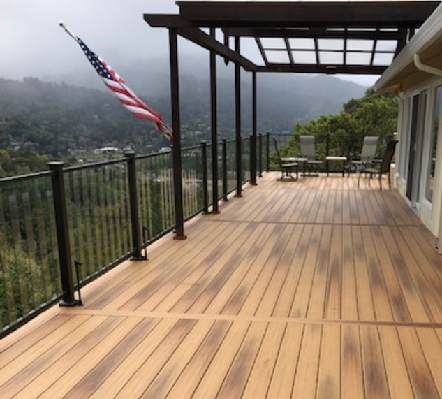 Installing Fortress Pure View Glass Baluster Railing on his upper-level deck ensures the best view, top level security, and the gentle Californian breeze