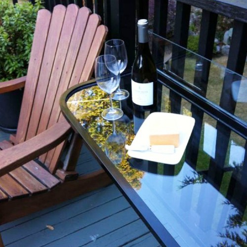 Outdoor tables that attach to deck railing systems create a stable dining spot without stealing floor space