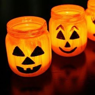 Make friendly and recyclable little jar jack-o-lanterns out of household recyclables to place out on the deck