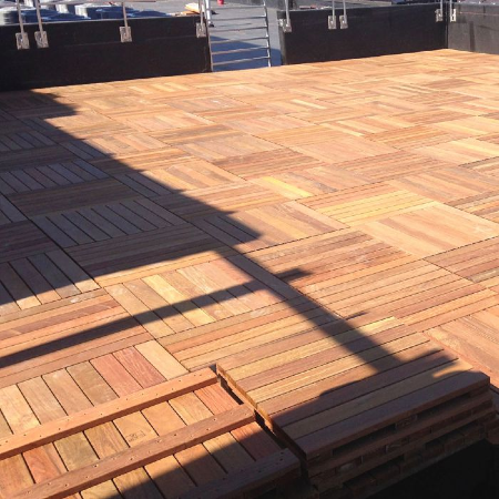 Find out everything you need to know about deck tiles, such as the Bison Ipe Wood Deck Tiles shown, to create your dream rooftop deck or patio