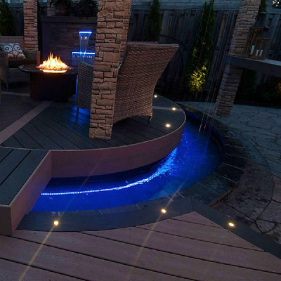 Planning in-floor deck lighting throughout your outdoor living space can highlight your home and deck railing design while providing safe light for walking