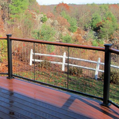 Installing a drink rail on on your deck railing between the post allows you to highlight decorative post caps and create individual areas within your one deck